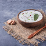 A cup of yogurt soup with garlic